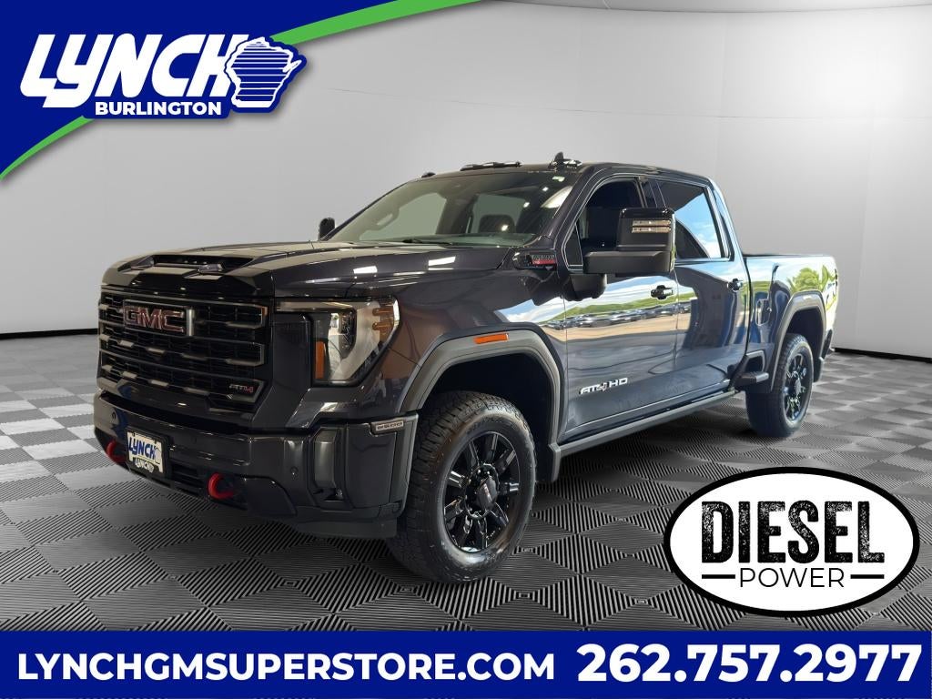 2024 GMC Sierra 2500 HD AT4 in Titanium Rush Metallic — front three-quarter view