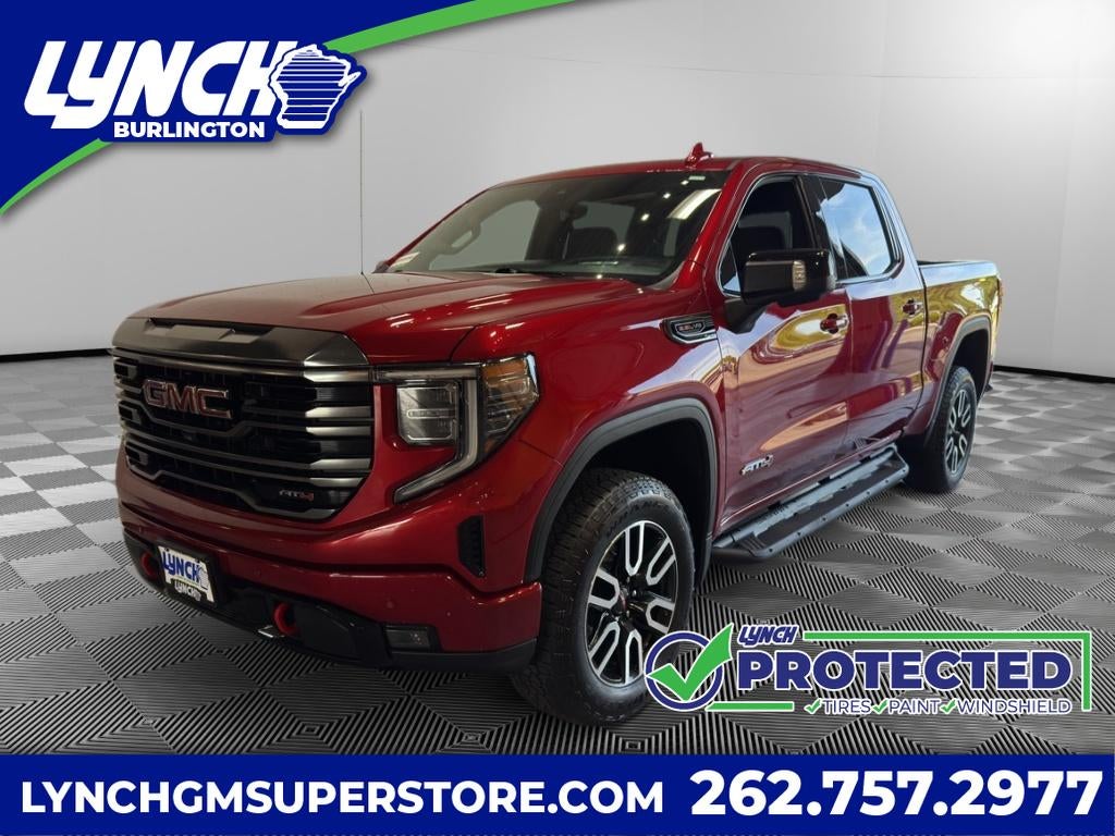 2023 GMC Sierra 1500 AT4 in Volcanic Red Tintcoat — front three-quarter view